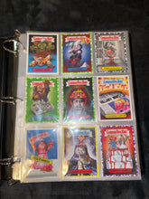 Load image into Gallery viewer, Brand New Original Pokemon Binder with 50 plastic page sleeves and 9 Horror Garbage Pail Kids card collection
