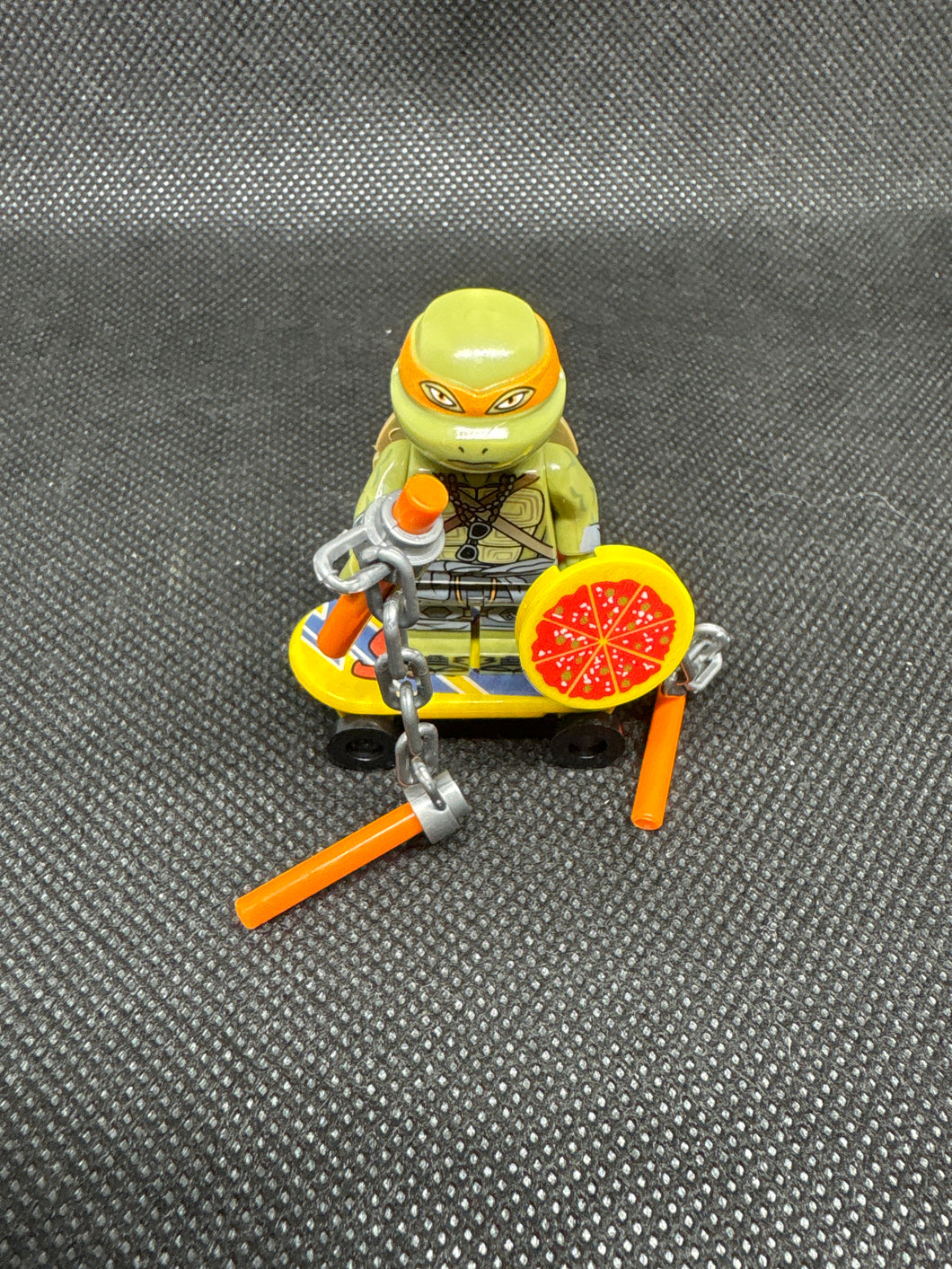 Brand New Vintage Michelangelo TMNT Mini Custom Lego with Nun chucks and Skateboard and Pizza